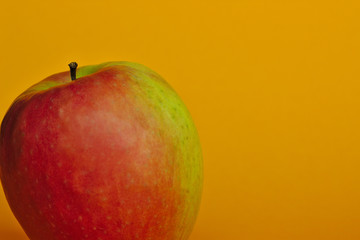 apple on yellow background