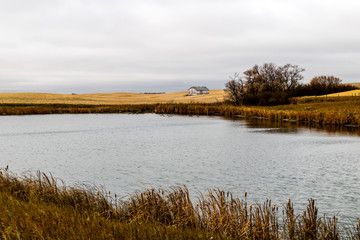 Abondoned farm buildings dot the landscape along HWY 4, Saskatchewan, Canada