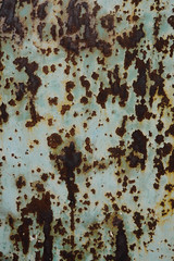 Iron wall with dark brown rust. Corroded metal. Background for design 