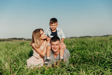 Parents and child on vacation playing together