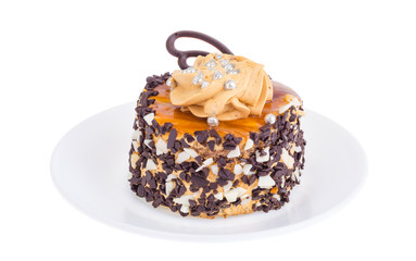 Caramel cake with butter cream and chocolate drops