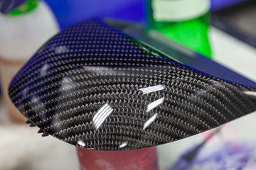 Carbon element of car gray and black in the form of weaving from Kevlar, a very durable and...