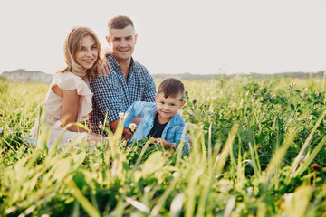 Beautiful family having a picnic in nature.