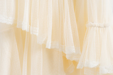 Beautiful handmade white wedding dress. Material closeup background.
