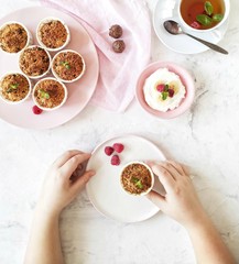 hands holding a bowl of soup