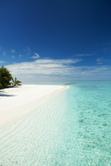 Tropical beach. White sand, blue sky and crystal sea of tropical beach. Ocean beach relax, travel to islands