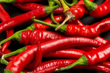 Red hot chili peppers on a black background