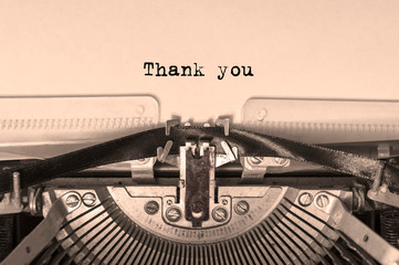 thank you printed on a sheet of paper on a vintage typewriter. writer.