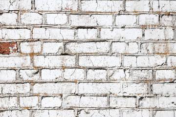 Old wall made of red brick, painted white in loft style for modern designer interior of room, bar or restaurant
