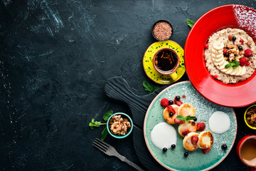 Cheese pancakes and oatmeal. Breakfast