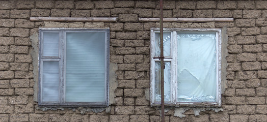 Vintage wooden windows with peeled paint.