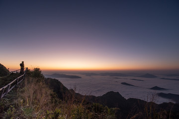 Chiang rai "Phu chee dao" famous mountain viewpoint for tourist with morning sunrise landscape.Doi pha tung located between "phu chee fah" and "Doi Pha tung" mountain in Wiang Kaen ,thailand