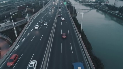Aerial top view of highway interchange on the sunset. Aerial top view of road junction from above, automobile traffic and jam of many cars, useful for engineering, industrial, transportation concept