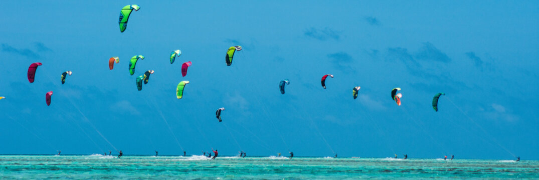 People practicing kitesurfing on a beautiful summer day - Caribbean - Archipelago of Los Roques - Venezuela