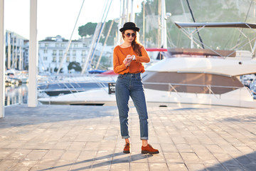 Young stylish girl in a sea port