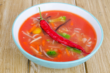 Spicy tomato soup with red peppers and vegetables.