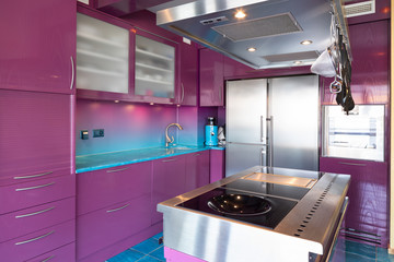 Modern elegant purple and blue kitchen in a luxury apartment