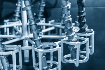 The casting parts of CAM shaft in the oven.The automotive part manufacturing process.