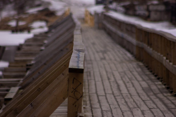 Wooden bridge at Vuoksa river estuary фе Priozersk, Priozersky District, Leningrad Oblast, Russia. March 2019.