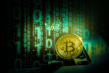 Golden bitcoin new currency, accepting bitcoin for payment, finance concept, laptop copy space