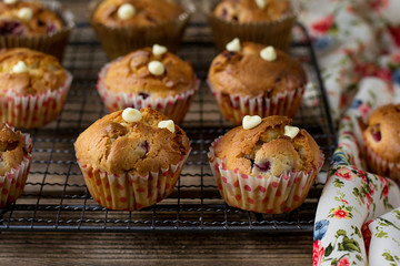 Sweet muffins with raspberries, cranberries and white chocolate chips
