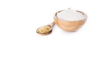 White rice flour in a bowl isolated on white background. Copyspace