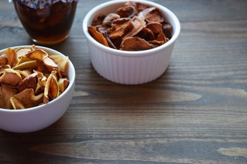 Various dried fruit displayed on an old wooden table.