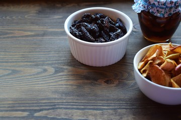 Various dried fruit displayed on an old wooden table.