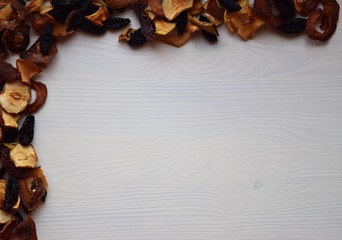 Various dried fruit displayed on an old wooden table.