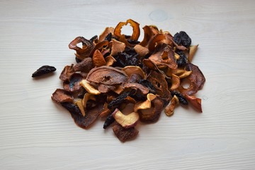 Various dried fruit displayed on an old wooden table.