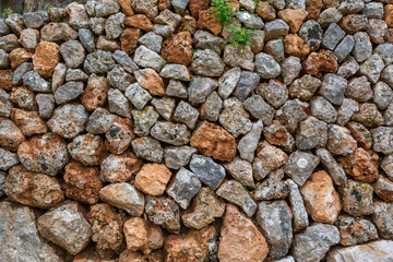Hintergrund: Steinmauer mit groben rustikalen und mediterranen Steinen