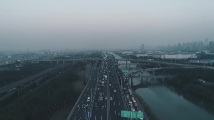 Aerial top view of highway interchange. Aerial top view of road junction from above, automobile traffic and jam of many cars, useful for engineering, industrial, transportation concept