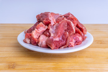 Fresh raw beef steak on wooden background with selective focus