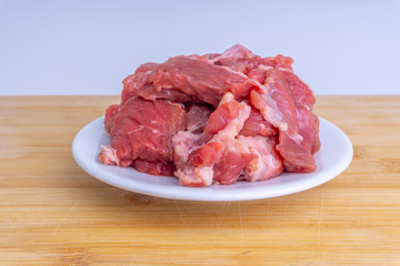 Fresh raw beef steak on wooden background with selective focus
