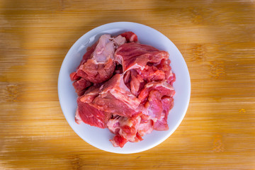 Fresh raw beef steak on wooden background with selective focus