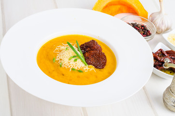 Delicious spicy pumpkin soup with parmesan.