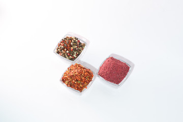Different spices on the white background