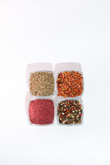 Different spices on the white background