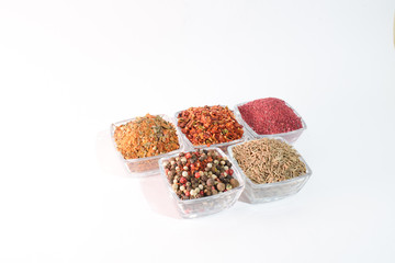 Different spices on the white background