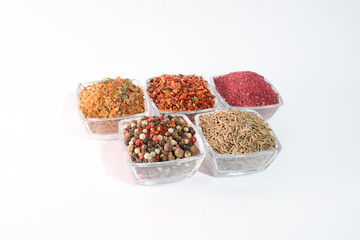 Different spices on the white background