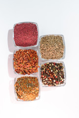 Different spices on the white background