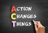 Color wooden alphabets building the word ACT - Action Changes Things acronym on blackboard