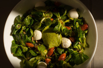 A guacamole salad with cannons, almonds, cheese and honey. 
