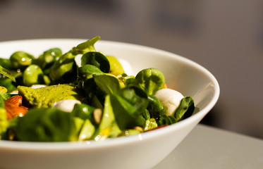 A guacamole salad with cannons, almonds, cheese and honey. 