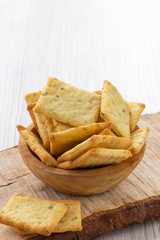 Dry salty cracker cookies in bowl on the table