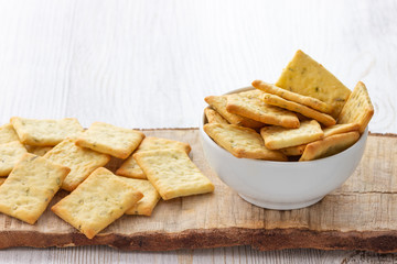 Dry salty cracker cookies in bowl on the table