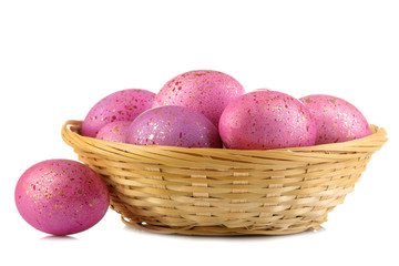 Easter. Pink easter eggs in basket on white isolated background. close-up. Happy easter. holidays