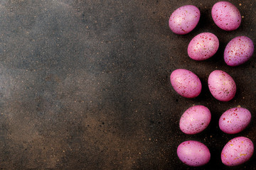 Easter. pink easter eggs on dark background. frame of eggs. Happy easter. holidays. top view. free place