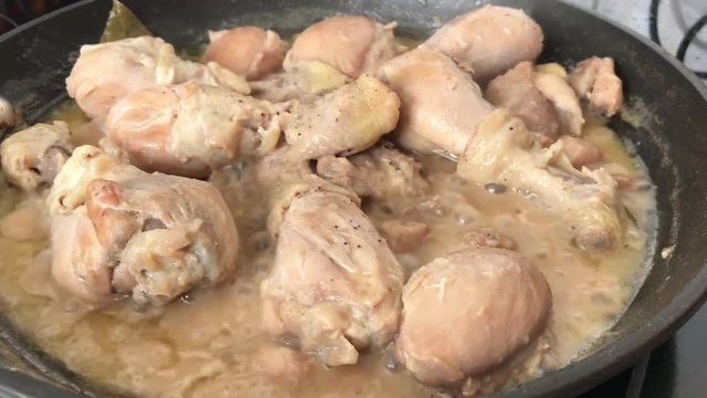 Chicken adobo cooking in a pan