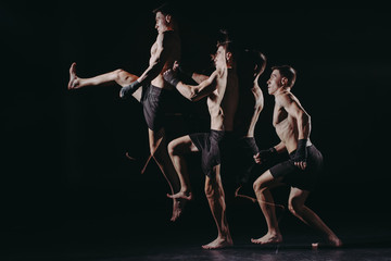 multiple exposure of strong barefoot muscular mma fighter doing kick in jump